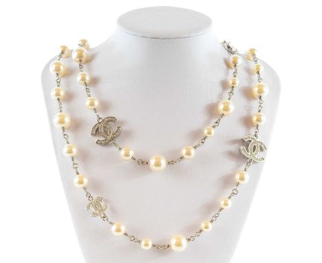 A Chanel white metal cultured pearl and white gem set CC long necklace. The clasp with etched marks 'CHANEL A18 V MADE IN FRA