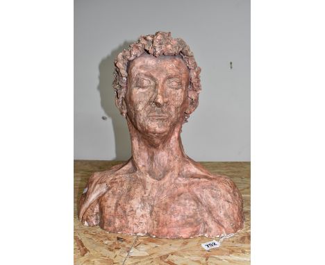 SCULPTURED BUST OF A MALE, hollow clay textured bust finished with a salmon pink/red glaze, detailed muscle structure on the 