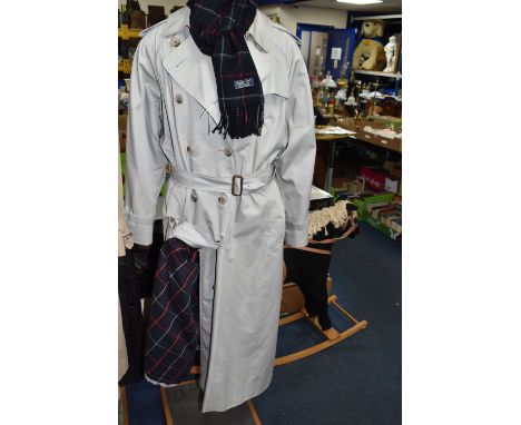 A LADIES  BURBERRYS TRENCH COAT, COAL BLUE  TRADITIONAL BURBERRY CHECKED LINING AND A COAL BLUE CHECKED CASHMERE SCARF,  a st