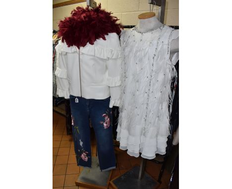 A LARGE QUANTITY OF TED BAKER CLOTHING, to include evening dresses, cocktail dresses, jackets, overcoats, jeans, burgundy col