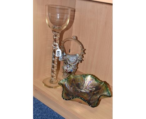 THREE PIECES OF ORNAMENTAL GLASSWARE comprising a green carnival glass fruit bowl with thistle patterns, diameter 23cm (arrow