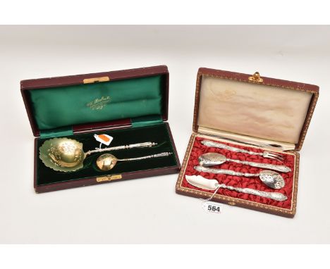 A CASED SET OF TWO FRENCH SPOONS AND ANOTHER SET OF CUTLERY, the first a serving spoon with shell shaped bowl engraved with b