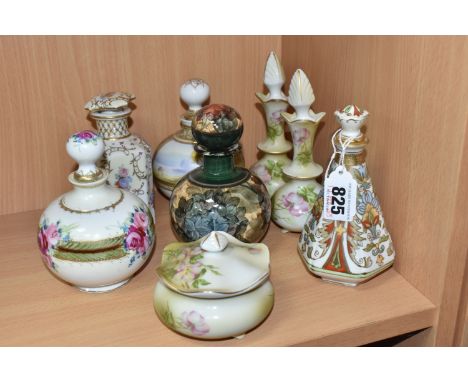 A GROUP OF EIGHT CERAMIC BOTTLES WITH STOPPERS to include two gilded Noritake bottles comprising one with floral patterns and