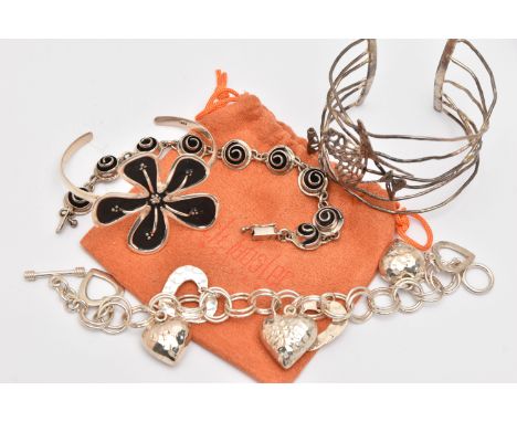 FOUR SILVER BRACELETS, to include a large flower detailed cuff bangle, hallmarked London, makers mark TS, a wire cuff bangle 