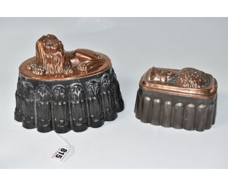 TWO MID-NINETEENTH CENTURY COPPER TOPPED JELLY MOULDS comprising a copper recumbent lion on a decorated fluted plinth, marked