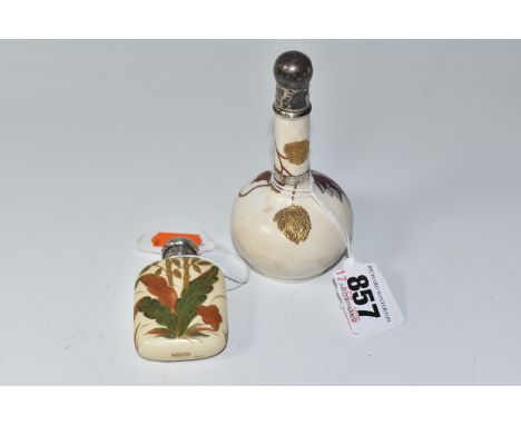 TWO NINETEENTH CENTURY SILVER TOPPED CERAMIC PERFUME SCENT BOTTLES to include a Wedgwood long necked scent bottle with hand p