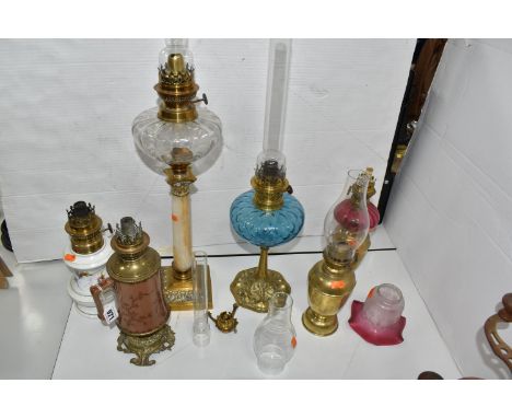 SIX OIL LAMPS AND ACCESSORIES ETC, comprising a brass and onyx lamp with a clear glass reservoir, approximate height 51cm, a 