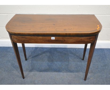 A GEORGIAN MAHOGANY FOLD OVER CARD TABLE, with a green baize playing surface, raised on square tapered legs, 98cm squared x d