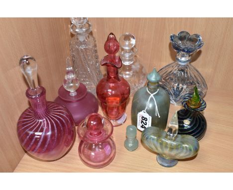 A COLLECTION OF ELEVEN  SCENT BOTTLES to include a Murano style twisting patterned scent bottle with a leaf shaped stopper wi