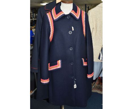 TWO NAVY BLUE LADIES BODEN OVERCOATS, comprising a navy blue flared hemline coat with red piping and lining, together with a 