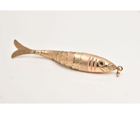 A 9CT GOLD ARTICULATED FISH PENDANT, textured body set with garnet cabochon eyes, fitted with an oval bail, hallmarked 9ct Lo