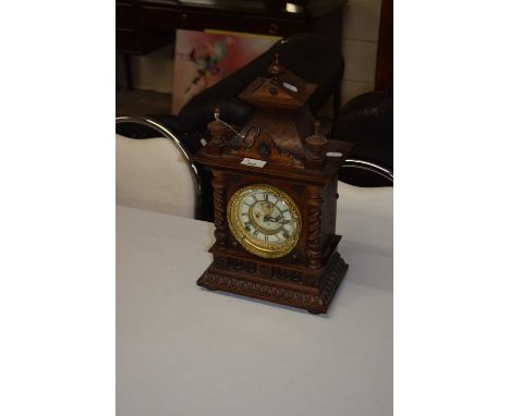 A late 19th Century mantel clock in architectural case with barley twist columns
