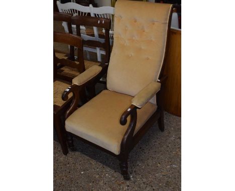 A Victorian button upholstered armchair