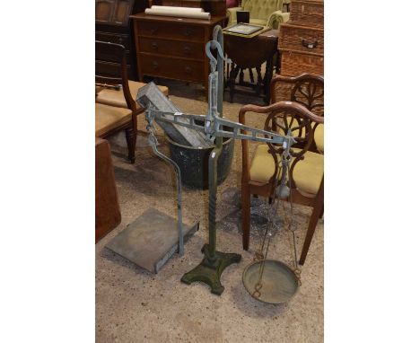 A pair of large brass beam scales, 125cm high