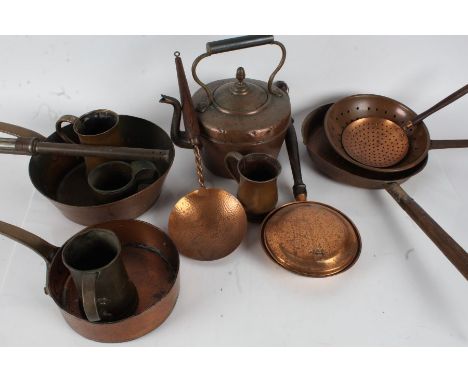 Collection of copper and brass ware to include a 20th century spot hammered ladle with a twisted stem, copper pans tankard, k