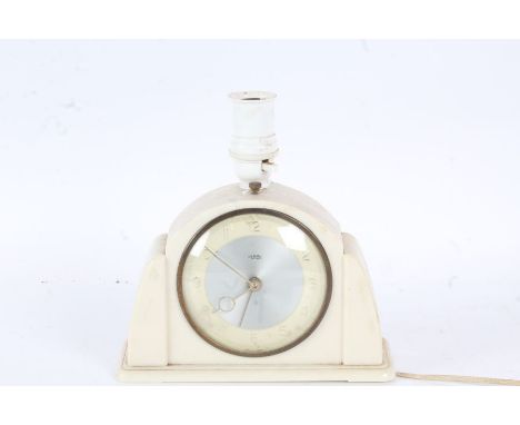 Art Deco Metamec bakelite mantel clock/lamp, having shaped white case, the dial with arabic numerals, the clock 14cm high