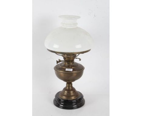 20th century brass oil lamp with a opaque white glass shade above a brass reservoir, 49cm high&nbsp;