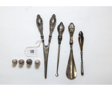 A pair of George V silver-handled CURLING TONGS, Birmingham 1913, a silver handled BUTTON HOOK, Chester 1915, a silver-handle
