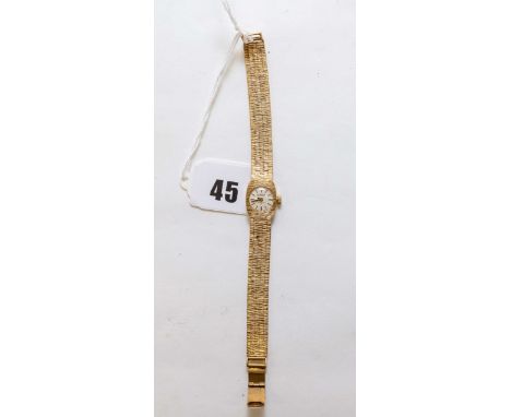 A lady’s 9ct gold ROAMER manual wind WRISTLET WATCH, bark finish with integral strap, stamped .375, approx. 21.8grams excludi