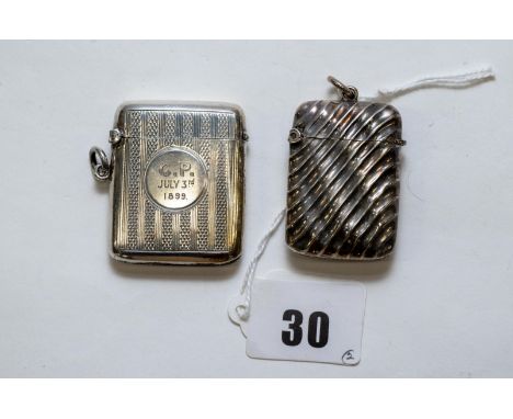 A late Victorian silver ribbed bodied flip top VESTA CASE, maker:- R.Bros, Birmingham 1897 & another with engine turned bandi