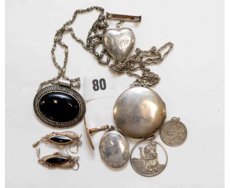 A hallmarked circular silver foliate engraved LOCKET, on a white metal neck chain, a heart-shaped LOCKET with suspension bar,