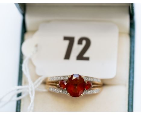 A 9ct gold red faceted stone set RING with diamond set shoulders, stamped .375, size W, approx. 3.2grams