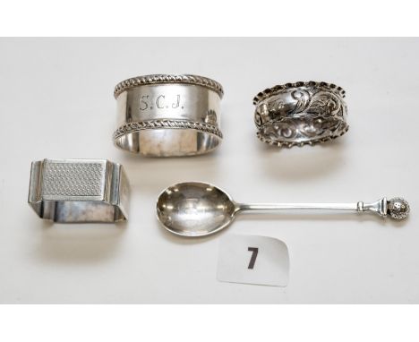 An Elizabeth II oval silver rope-edge NAPKIN RING, Birmingham 1965, another Birmingham 1927, a circular embossed DITTO, Birmi