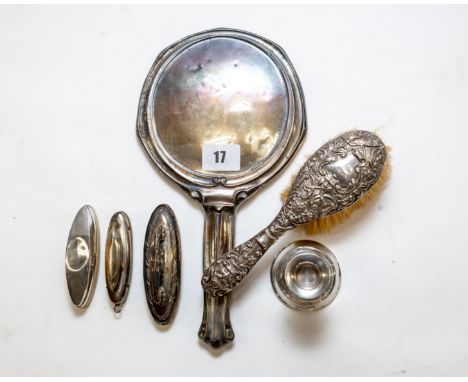 An Edwardian silver art Nouveau influence HAND MIRROR, Chester 1906 (faults), a small embossed silver HAIRBRUSH, Chester 1901