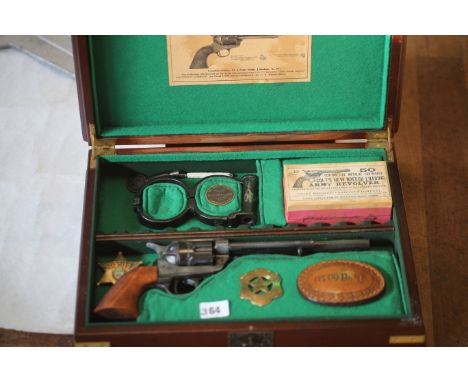 Colt Revolver, old replica in fitted case along with Sheriffs badge and handcuffs etc 