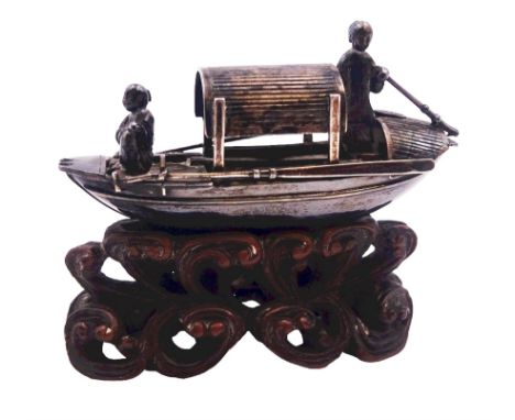 Chinese miniature silver model of a junk, with character mark to stern, mounted upon a carved wooden stand, overall H5cm L6.5