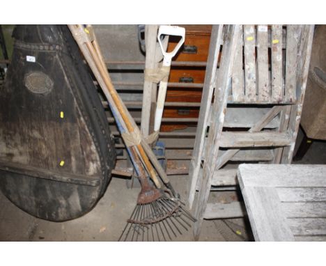 Two bundles of long handled gardening tools