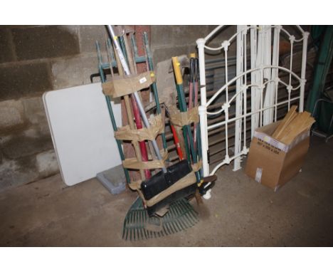 Two bundles of long handled gardening tools