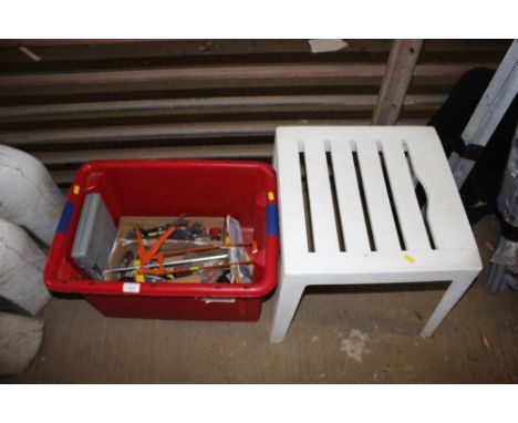 A plastic footstool; and a box of various hand tools 