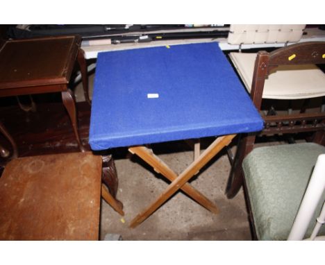 A folding card table