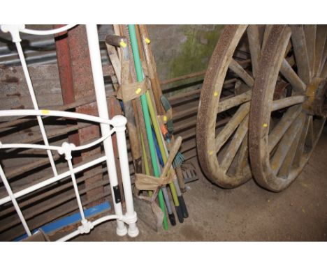 Two bundles of long handled gardening tools
