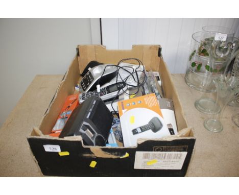 A box containing cordless phones, Goodmans speaker, printer ink etc 