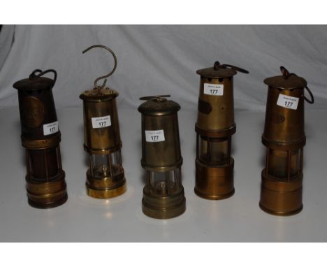 A miner's Hailwoods safety lamp and four similar miners’ lamps