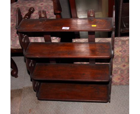 A 19th Century mahogany four-shelf wall bookcase with pierced sides