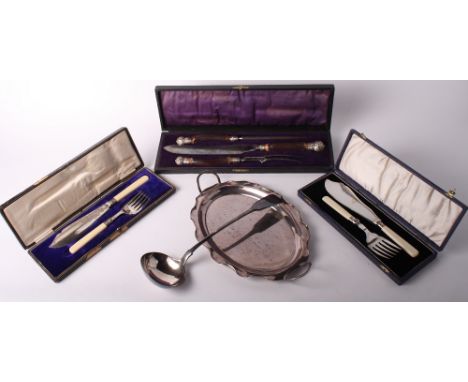 A three-piece bone handled carving set, in case, two sets of fish servers, one with silver ferrules, in cases, a silver plate