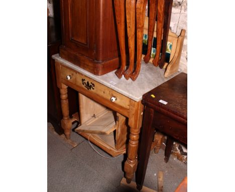 A waxed pine washstand with raised tile back over one drawer and cupboard