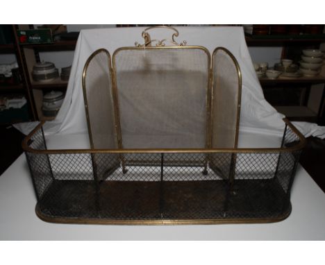 A brass framed three lap fireguard and a brass framed wirework fender