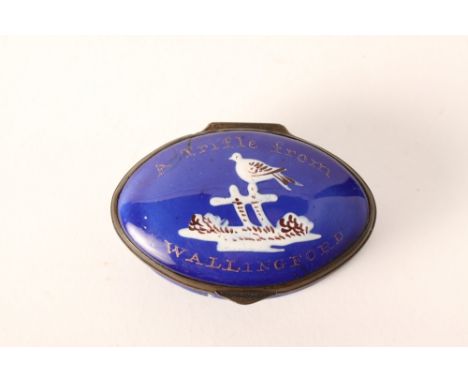 An 18th Century Staffordshire blue enamel patch box, lid inscribed "A trifle from Wallingford" and decorated with a bird perc
