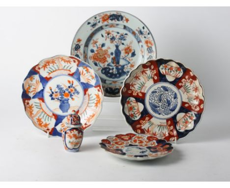 Three 19th Century Imari porcelain dishes, 9" dia, a similar smaller dish and a ginger jar and cover