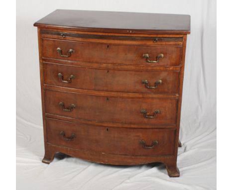 A 19th Century mahogany chest of drawers, fitted brushing slide over four long graduated drawers, on splayed bracket supports