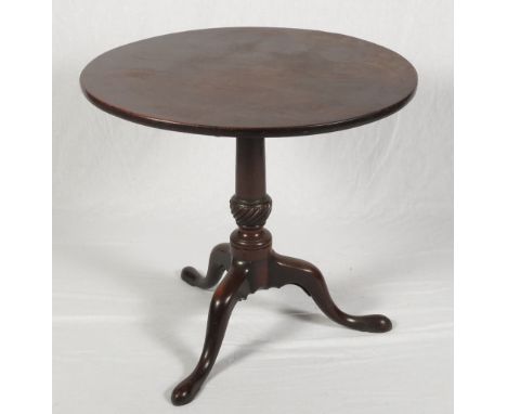 A Georgian mahogany circular tilt-top occasional table, on column and tripod splay supports and pad feet, 29" dia