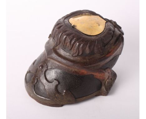 A 19th Century wood table snuff box carved as a horse's hoof with hinged brass cover