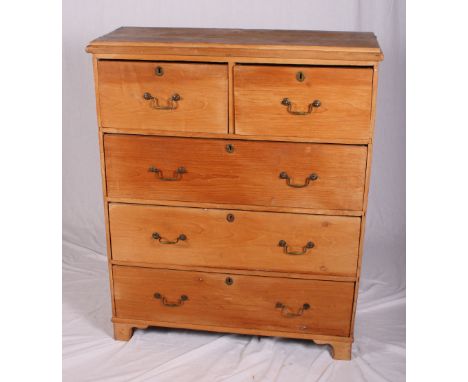 A Victorian pine chest of two short and three long drawers with brass handles, on bracket supports, 38" wide x 14" deep