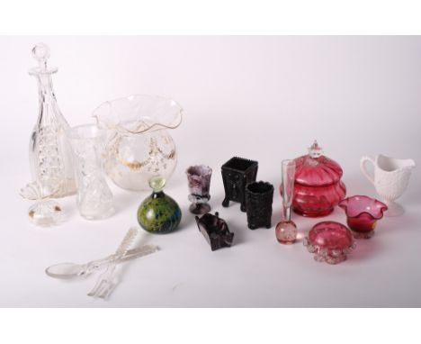 A bulbous glass vase decorated swags in gilt, a cut glass decanter, three ruby glass bowls and pressed glass ornaments, etc