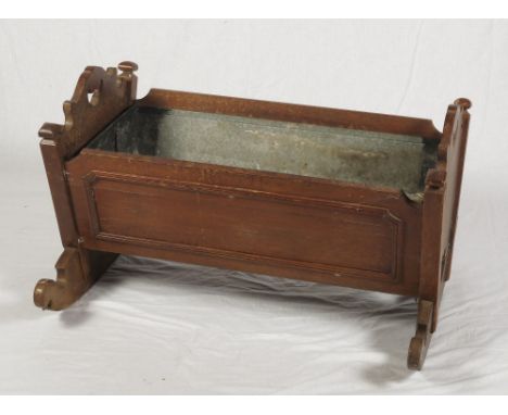 A 19th Century oak crib, fitted as a plant trough with metal liner