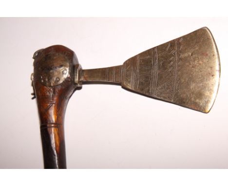 An African axe with gilded and engraved blade on carved wooden shaft, 24" long